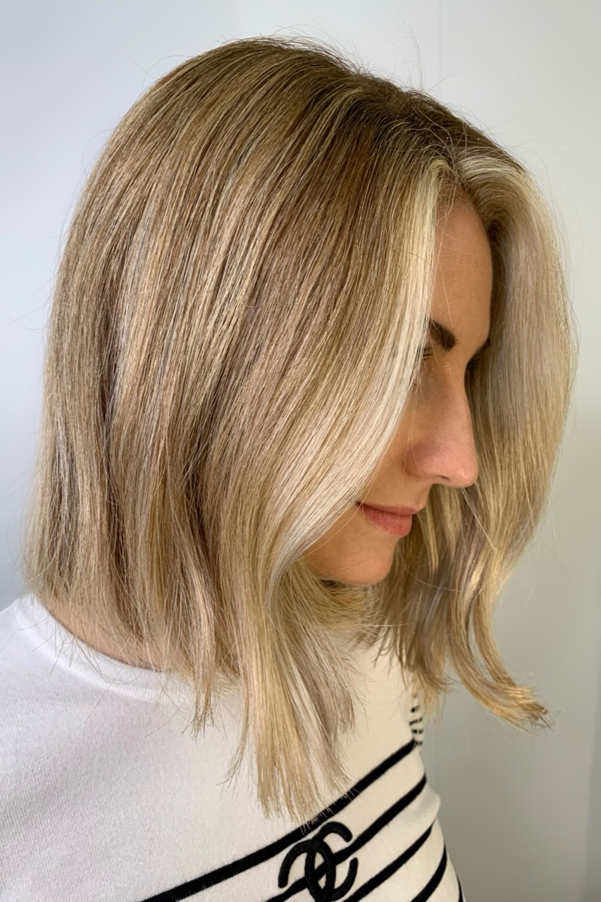 Dimensional blonde after a two-visit brassy blonde correction